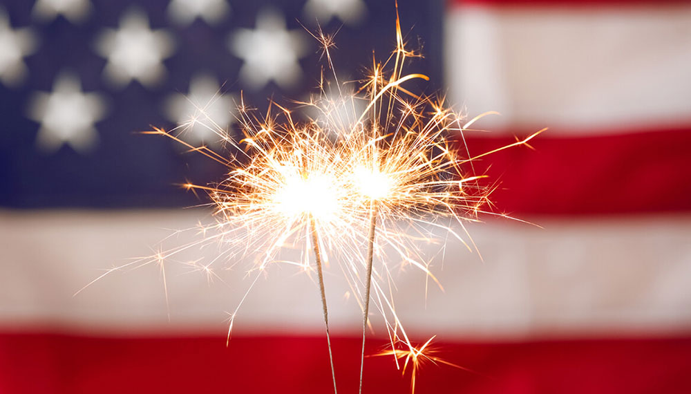 Fireworks with American Flag in the background
