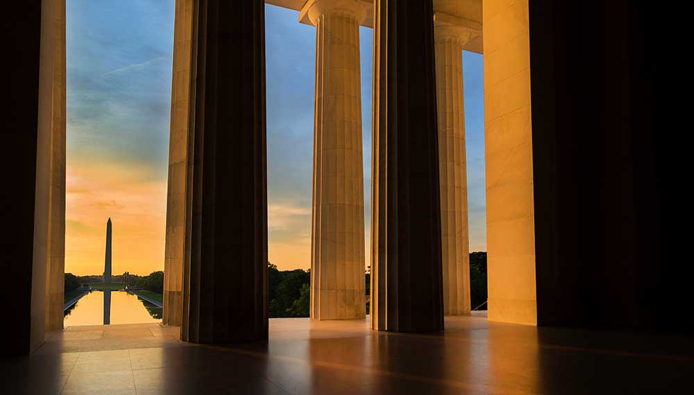 Early morning summer sunrise as seen from the Lincoln Memorial while looking toward the Washington Monument in Washington, DC