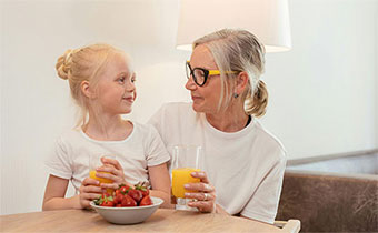 woman and child sitting at a table